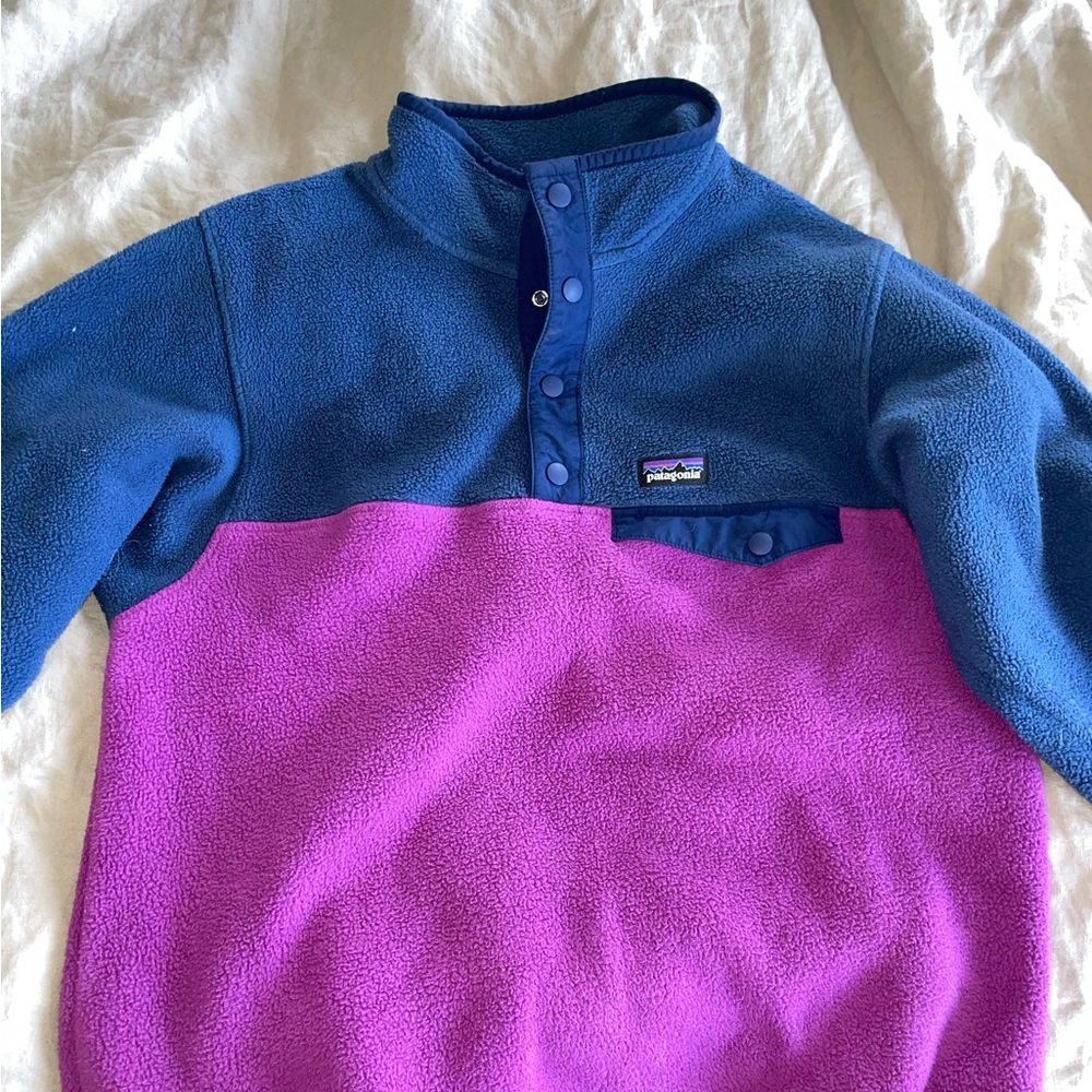 Patagonia youth XL synchilla fleece. Navy and purple. Four snap long sleeve.